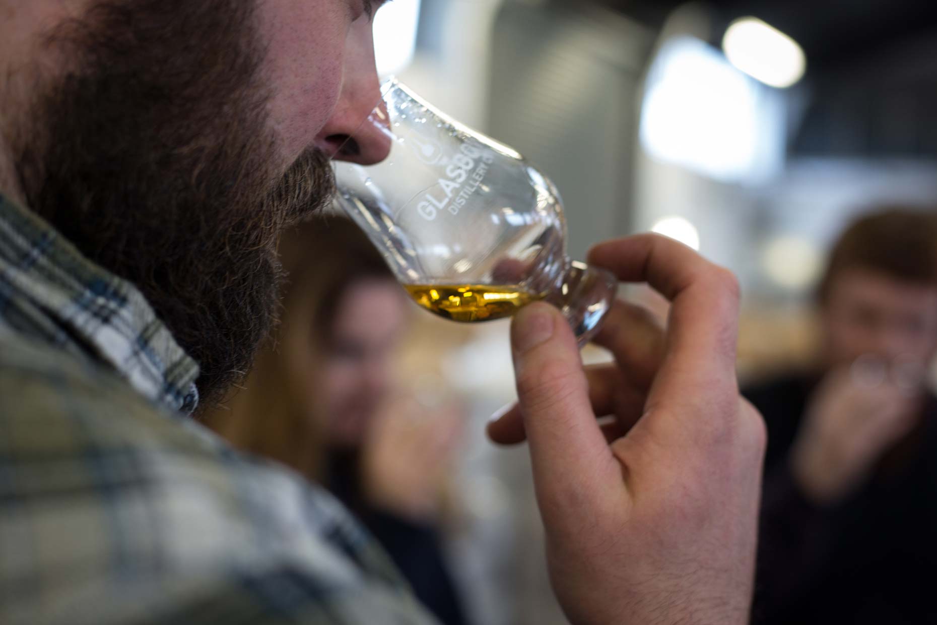 Nosing a dram of Scottish single malt whisky, Scotland