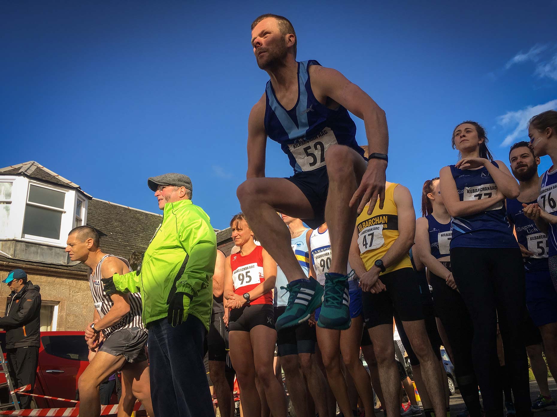 Running club athletes competing, by Scotland photographer
