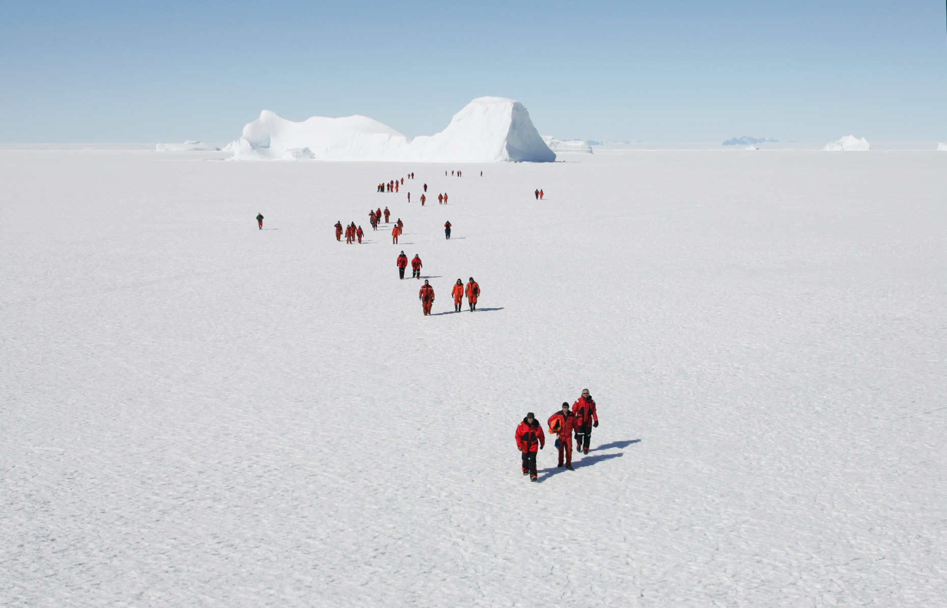 People walk across the Antarctic ice shelf, by Scotland Greenpeace photographer 